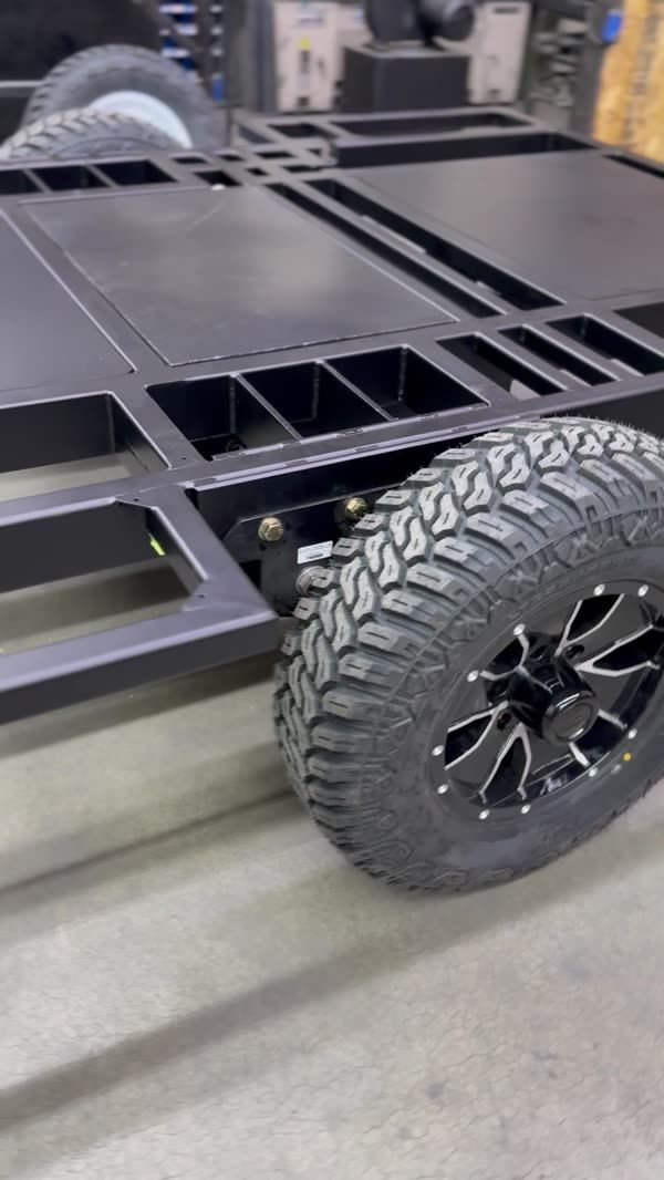 Trailer frame with an off-road wheel and tire fitted