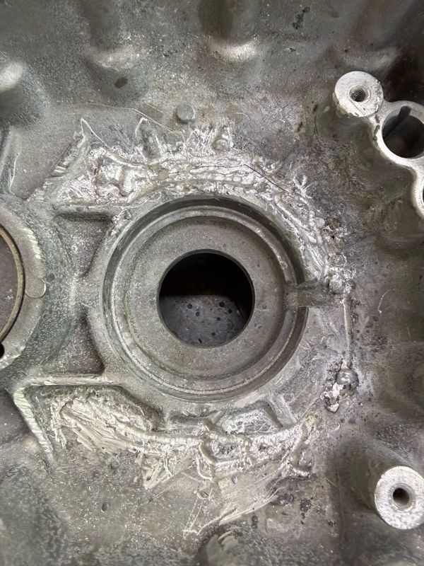 Cracked cast aluminum case before repair