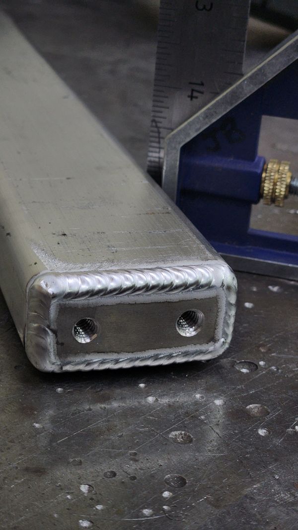 Aluminum tube end cap with tapped holes