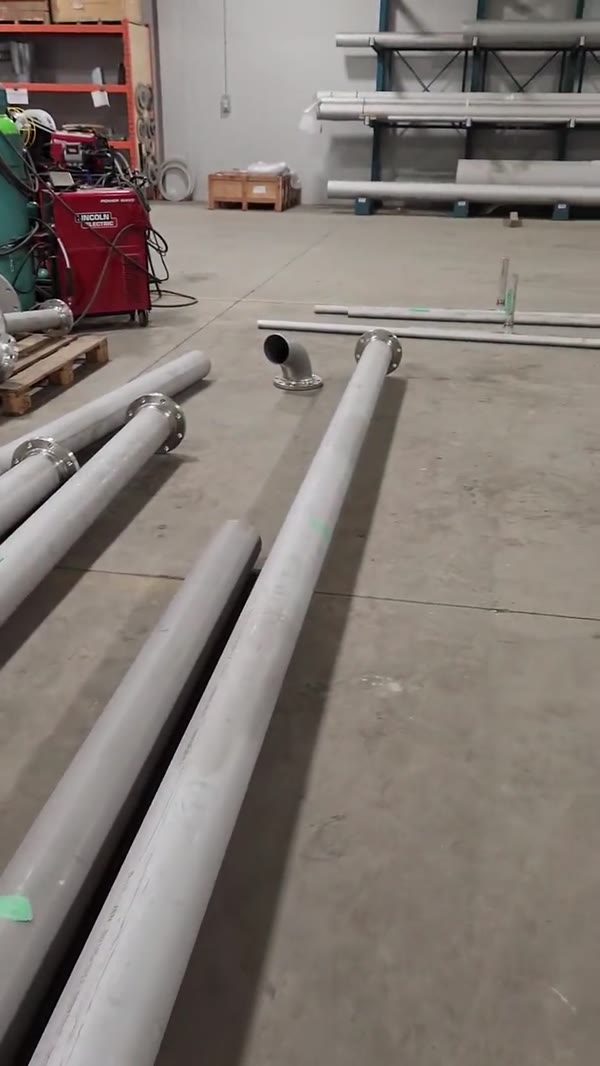 Finished stainless tubes laid out on the shop floor