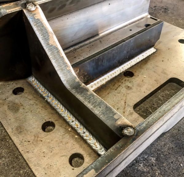 Steel brace fillet welded to a base plate