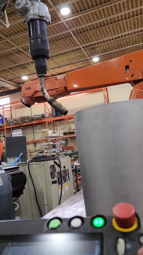 Robotic welding cell with a stainless cylinder